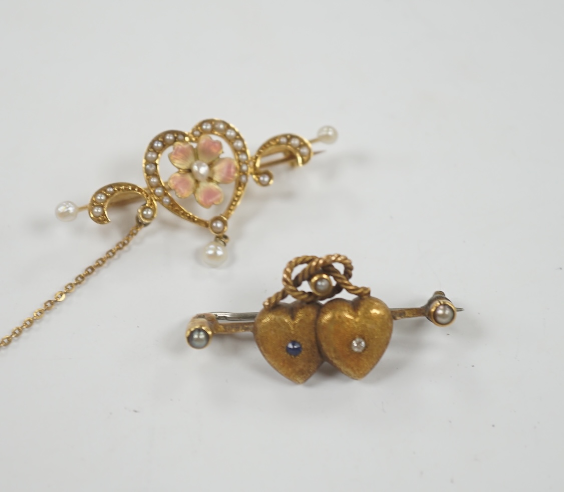 An Edwardian 625 yellow metal, enamel and seed pearl set drop bar brooch, with central heart shaped motif, 40mm, together with a yellow metal and gem set twin hearts bar brooch.